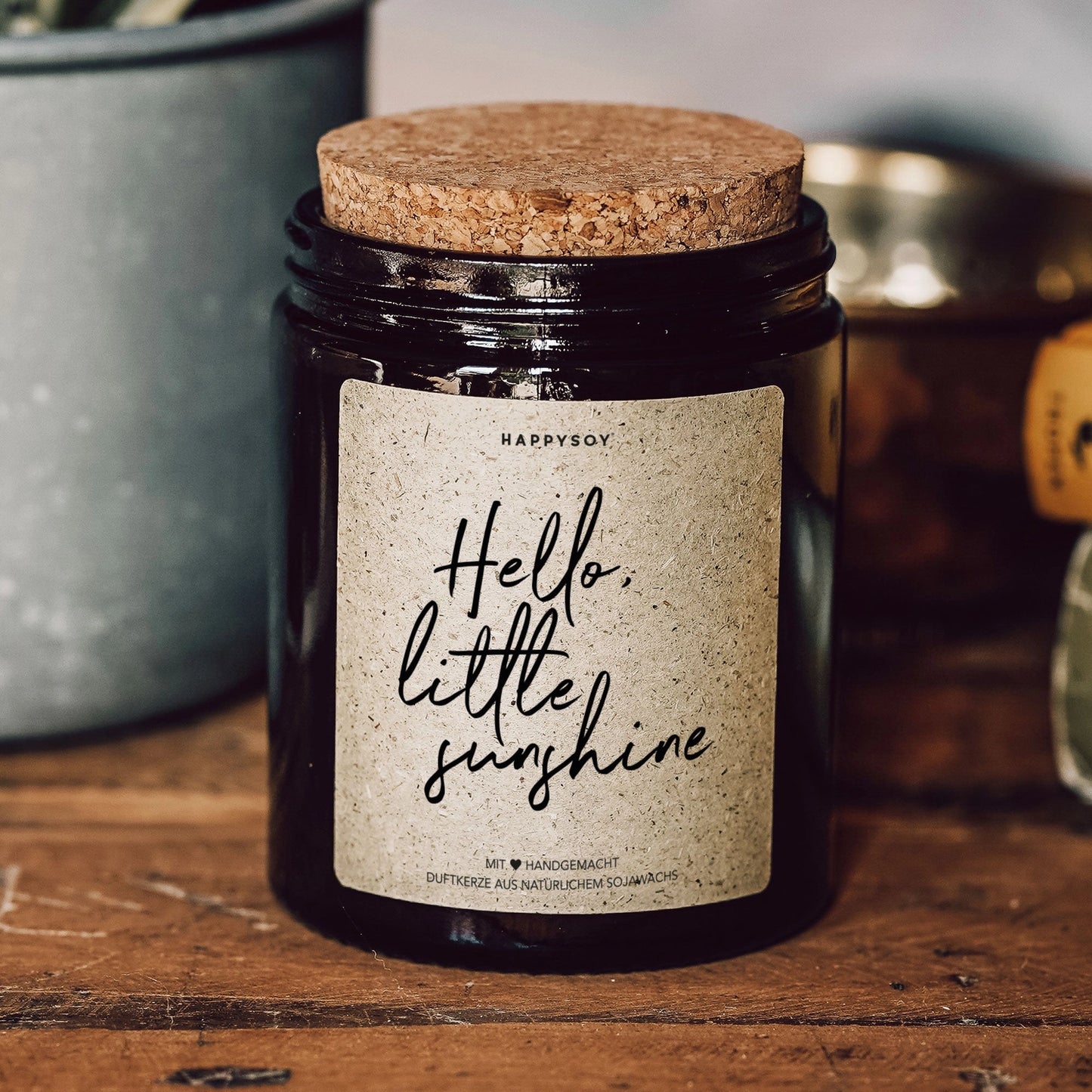 Scented candle with inscription 'Hello little sunshine'